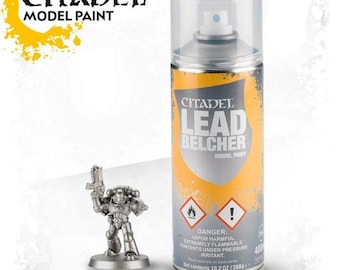 May include: A can of Citadel Lead Belcher Model Paint next to a silver miniature figure. The paint can is silver with a yellow and gray label. The label reads "Citadel Lead Belcher Model Paint". The can contains 10.2 oz / 288g. The miniature figure is of a soldier holding a gun.