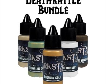 May include: A bundle of six Darkstar Miniatures paint bottles. The bottles have black caps and contain various colors, including gold, green, and brown. The text "Deathrattle Bundle" is at the top.