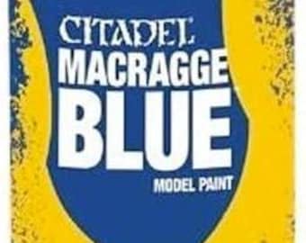 May include: A can of Citadel Macragge Blue model paint with a clear plastic cap. The can has a blue and yellow label with the text "Citadel Macragge Blue Model Paint". It contains 10.5 oz / 297g of paint.