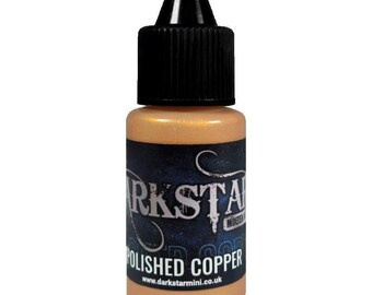 May include: A small bottle of "Polished Copper" paint with a black cap and a dark blue label. The label features the brand name "Darkstar" in white script and the website address www.darkstarmini.co.uk.