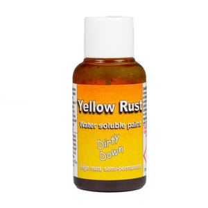 May include: A bottle of "Yellow Rust" water-soluble paint. The label is yellow with black text that reads "Dirty Down" and "High matt, semi-permanent." The bottle has a white cap and contains a brown liquid.