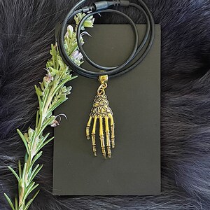 Gold Plated Skeleton Hand Necklace With Silicone Neck Cord