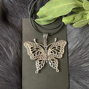 Large Silver Tone Butterfly Necklace With Silicone Neck Cord