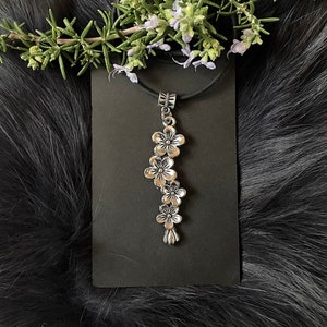 Long Silver Tone Plum Blossom Necklace With Silicone Neck Cord