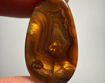 beautiful fire agate of the best AAA quality.measures 22.19x12.64x3.79mm weight 8.5 ct