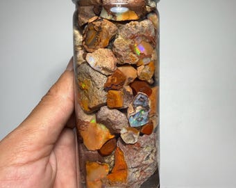 beautiful jar of fire opal in water of collection
