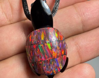 Incredible black obsidian turtle inlaid with the finest quality lab-grown opal.