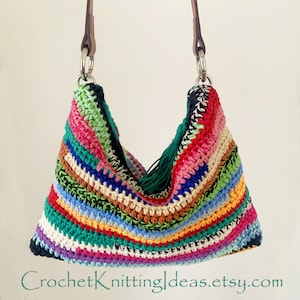 May include: A colorful striped crocheted handbag with a green tassel and brown leather straps. The bag is made with a variety of colors, including red, pink, blue, green, yellow, and white.