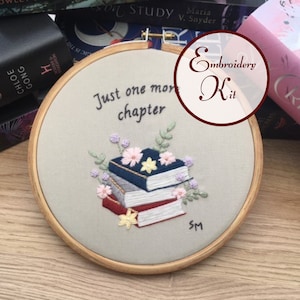 May include: Embroidery kit featuring a stack of books with flowers and the text "Just one more chapter".