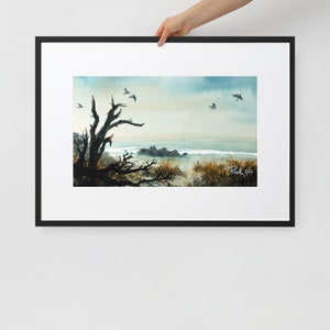 Sea gulls gathering above driftwood shore - Framed print with mat