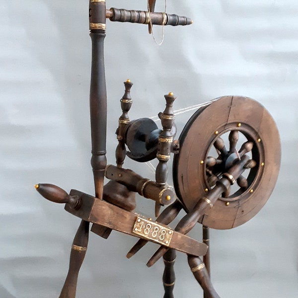 Antique unique working Spinning Wheel with encrustations and bronze details. with date: 1888 + detail gifts