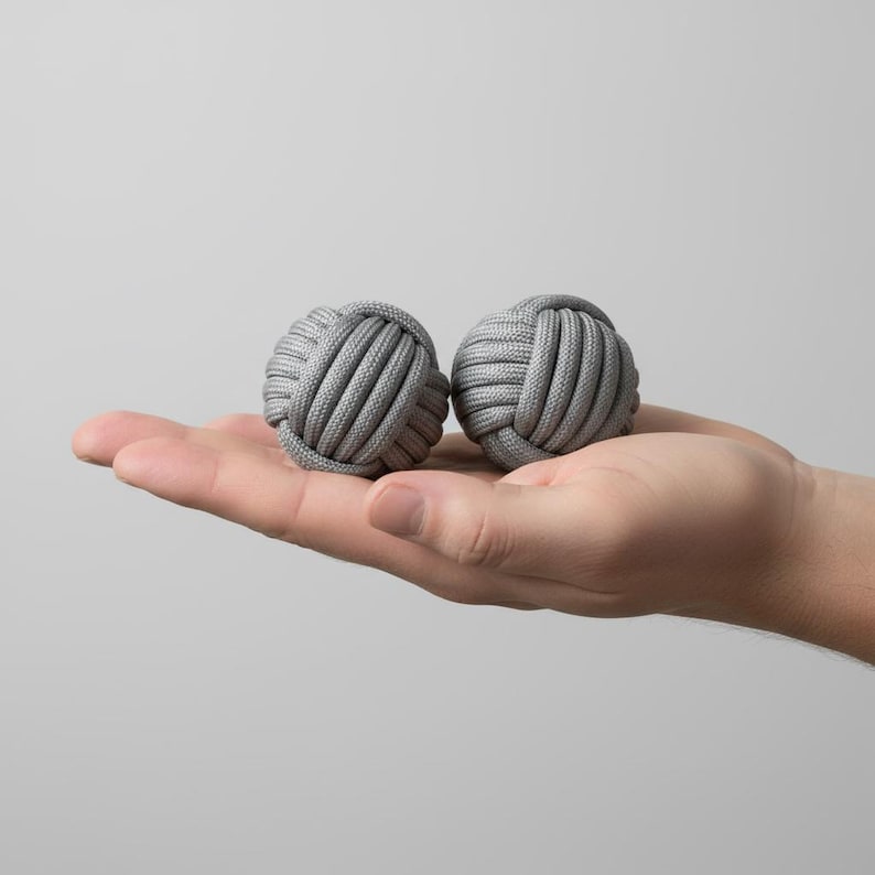 wooden monkey fist
paracord ball toy
pocket skill toy
hand fidget set
tactile desk toy
natural wood fidget
quiet hand toy
travel pocket toy
coordination toy
minimalist gift
handmade fidget
edc pocket toy
skill play balls