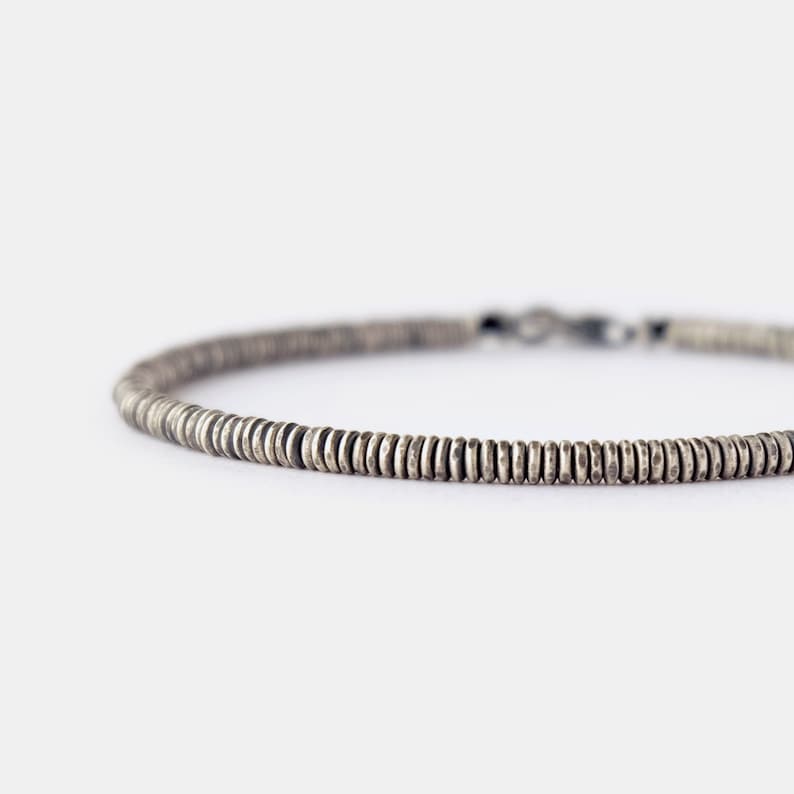Minimalist oxidized silver mens bracelet made of 3mm handcrafted silver heishi beads and finished with secure lobster clasp for comfortable everyday wear.