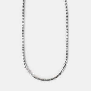 May include: A silver chain necklace with a delicate, textured design.