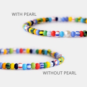 May include: Two colorful beaded bracelets, one with a white pearl and one without. The bracelets are made with small, colorful glass beads in various patterns. The text "WITH PEARL" and "WITHOUT PEARL" is displayed above each bracelet.