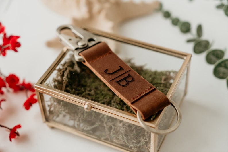 a keychain made of leather comes with laser-engraved initials or short phrase is a good gift for an older man