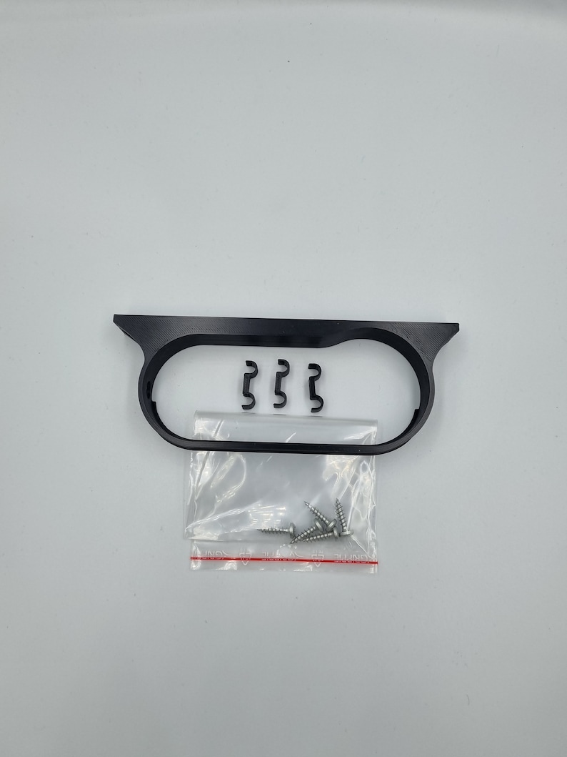 May include: Black plastic frame with three metal clips and a bag of screws.