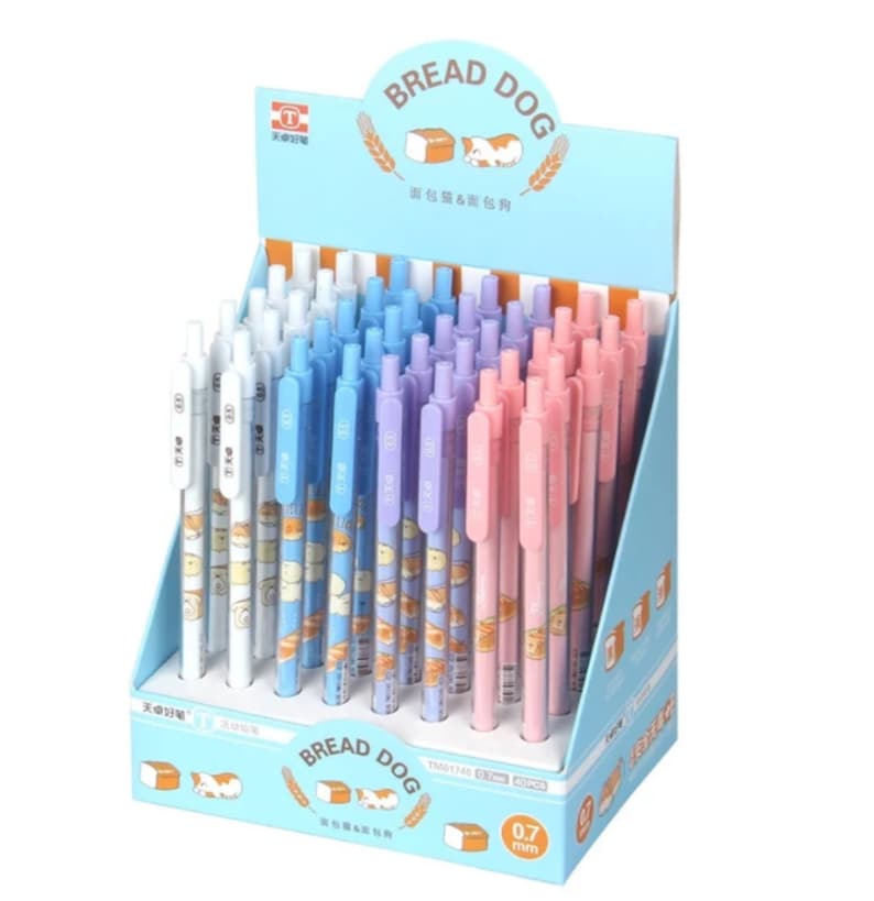 May include: A display of 40 pink, blue, and white mechanical pencils with a bread and dog design. The pencils are 0.7 mm and are labeled "Bread Dog".