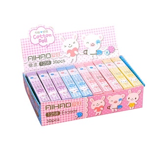May include: A box of 30 pink and blue eraser pencils with cartoon animal designs. The box has a pink and white checkered pattern and the text "AIHAO 爱好 1258 30pcs" on the front.