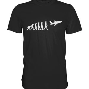 Może przedstawiać: Czarny T-shirt z białą sylwetką ewolucji człowieka, kończącą się na człowieku pilotującym samolot.