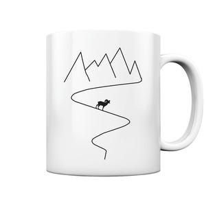 May include: White ceramic mug with a black line drawing of a mountain range and a bighorn sheep walking on a winding path.