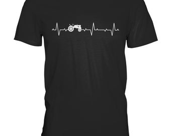 May include: Black t-shirt with a white tractor graphic and a white heartbeat line. The tractor is in the middle of the heartbeat line.