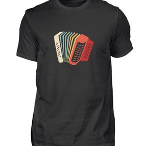 May include: A black t-shirt featuring a vintage-style illustration of a red, yellow and blue accordion.
