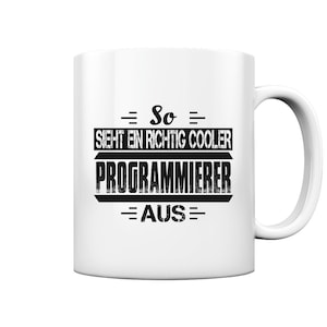 May include: White ceramic mug with black text that reads "So sieht ein richtig cooler Programmierer aus".
