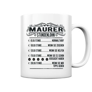 May include: White ceramic mug with a black design that says "MAURER STUNDENLOHN" and lists hourly rates in Euros with descriptions like "NORMALTARIF" and "WENN SIE MIR TIPPS GEBEN".