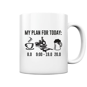 May include: White ceramic mug with a black design that says "My Plan For Today:" with a coffee cup, a train, and a beer mug. The times 8.0, 9:00 - 19.0, and 20.0 are written below the images.