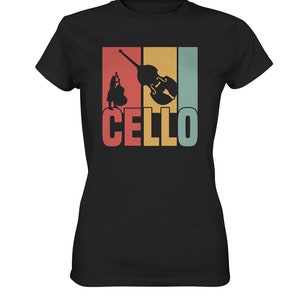 Może przedstawiać: Czarny T-shirt z grafiką w stylu vintage przedstawiającą wiolonczelę i napis "CELLO" w kolorowych literach.
