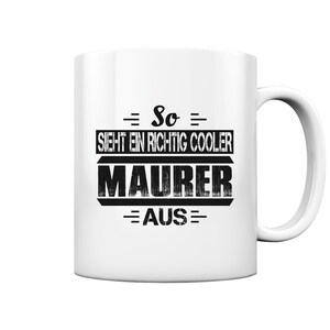 May include: White ceramic mug with black text that reads "So sieht ein richtig cooler Maurer aus".