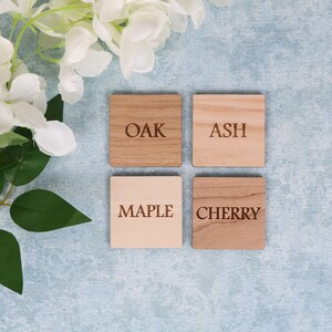 May include: Four wooden squares with the words "Oak", "Ash", "Maple", and "Cherry" engraved on them.