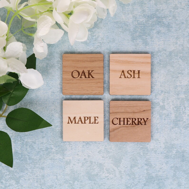 May include: Four wooden squares with the words "Oak", "Ash", "Maple", and "Cherry" engraved on them.