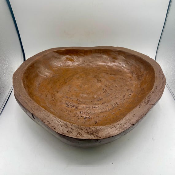 An 18-inch one-of-a-kind organic wood sculpture bowl — the wabi-sabi asymmetry and raw natural form make it a genuine centerpiece, not just a bowl.