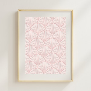 May include: A framed print with a pink and white geometric pattern of overlapping fans. The print is in a light wood frame.