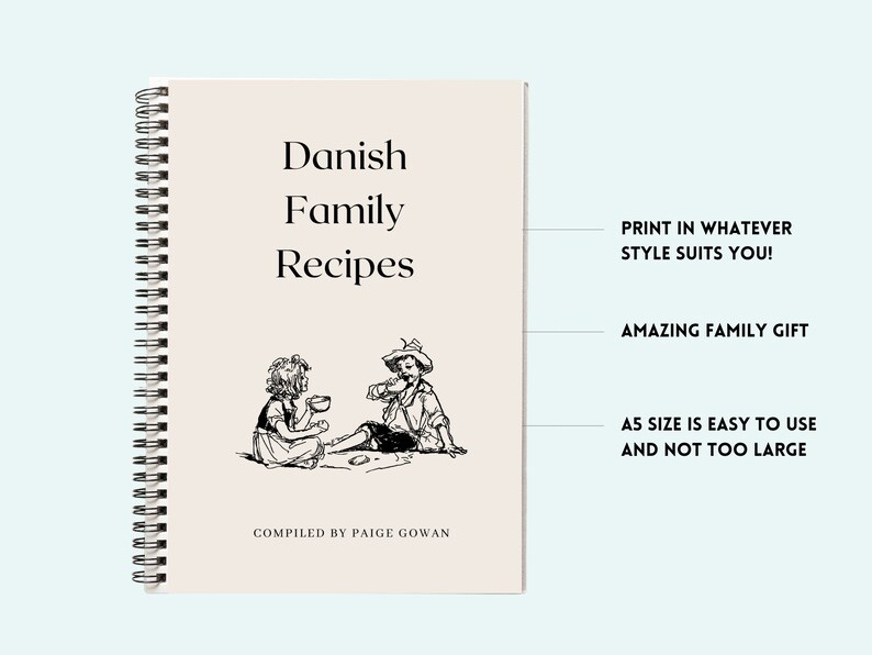 Puede incluir: Un libro de cocina en espiral con una cubierta beige que presenta una ilustraci&oacute;n en blanco y negro de dos ni&ntilde;os sentados en el suelo. El t&iacute;tulo del libro es "Recetas familiares danesas" y el texto "COMPILED BY PAIGE GOWAN" est&aacute; en la parte inferior de la cubierta.
