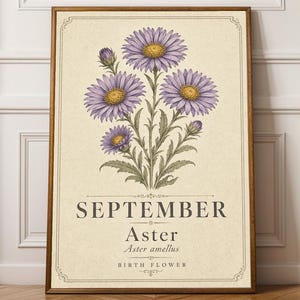 May include: A rectangular wall art print featuring a botanical illustration of purple aster flowers with yellow centers on a cream background. The text reads SEPTEMBER, Aster, Aster amellus, and BIRTH FLOWER, enclosed in a decorative border.