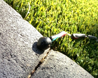 Black,blue, and red jointed clay snake