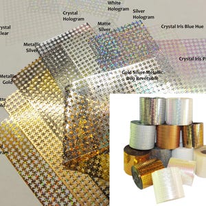 May include: A collection of star-patterned adhesive vinyl rolls and sheets in various finishes including gold hologram, matte gold, metallic gold, metallic silver, matte silver, white hologram, crystal hologram, and crystal iris blue and pink hues.