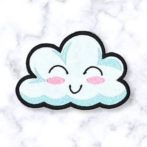 May include: A blue embroidered patch shaped like a cloud with a smiling face and pink cheeks.