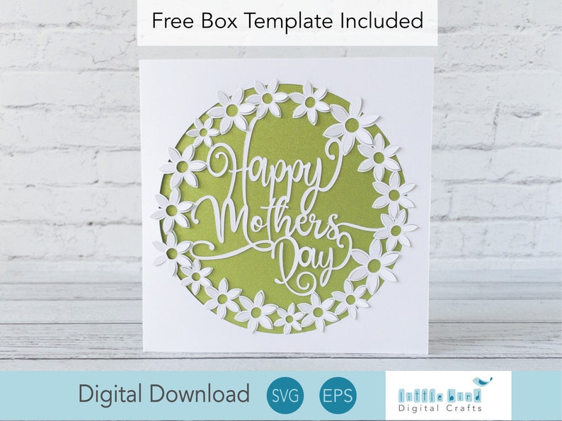 May include: A white card with a green circle in the center. The circle has a white daisy flower border and the text "Happy Mother's Day" in a white cursive font.