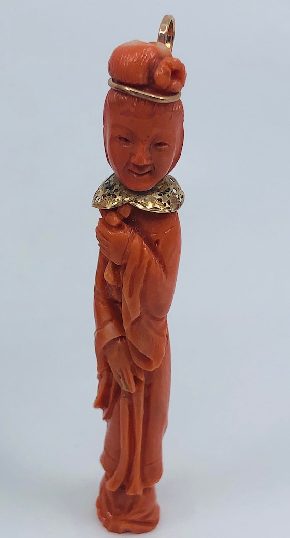 A Hand Carved Female Coral Pendant.