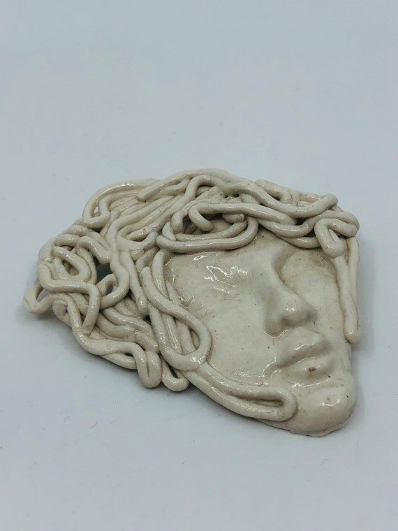 Hand carved brooch
