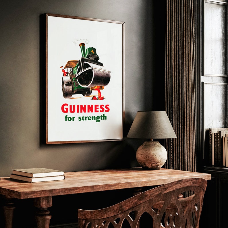 May include: A vintage poster advertising Guinness beer. The poster features a cartoon illustration of a steamroller with the text "GUINNESS for strength".