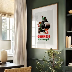 May include: A vintage Guinness poster featuring a cartoon steamroller wearing a green hat and the text "GUINNESS for strength".