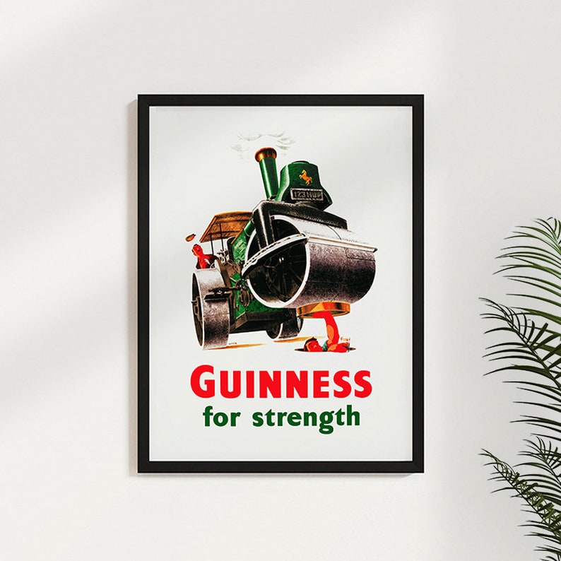 May include: A vintage Guinness advertisement featuring a green steamroller with a red figure standing in front of it. The text reads "GUINNESS for strength".