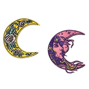 May include: Two embroidered crescent moon patches. One is yellow with floral and leaf details. The other is pink with a woman's face, stars, and purple hair.