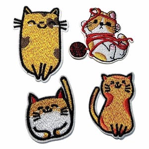 May include: Set of four embroidered cat patches. Each patch features a different cat design, including a cat with a ball of yarn, a smiling cat, and a cat with its paw raised. The patches are in shades of yellow, orange, brown, and white.
