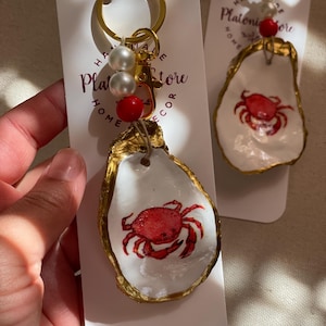 Oyster shell keychain / decoupaged red and white crab design oyster shell keychain